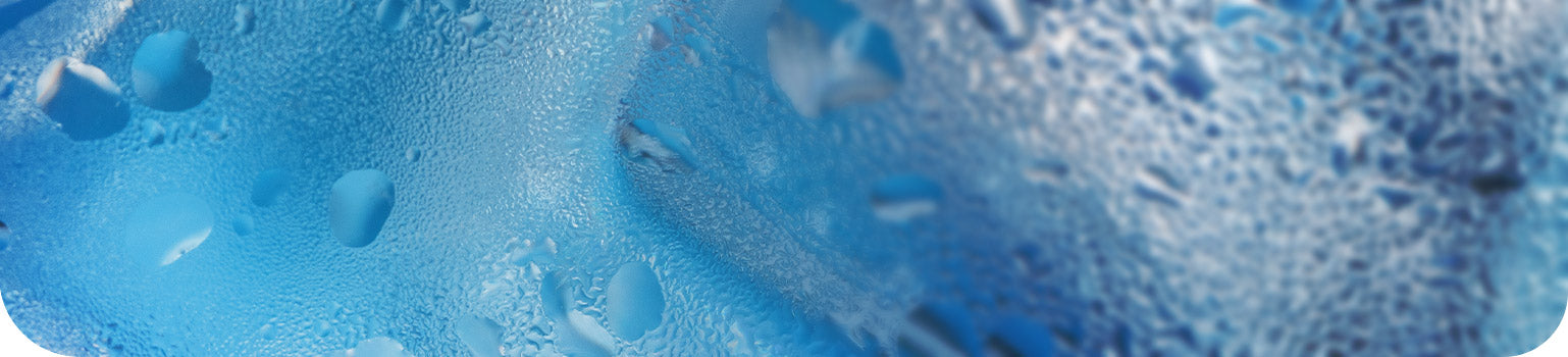Close-up of ice texture with condensation, blue tones.